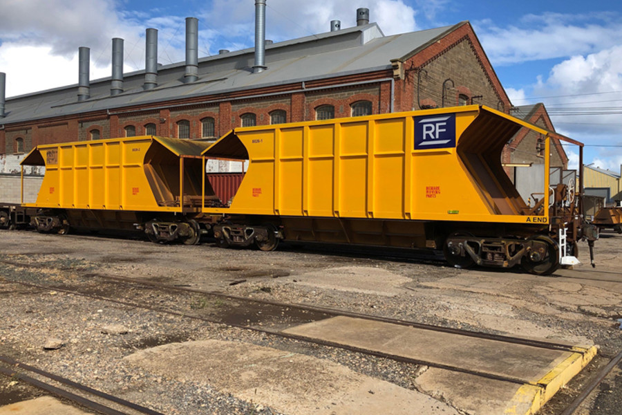 yellow train on tracks