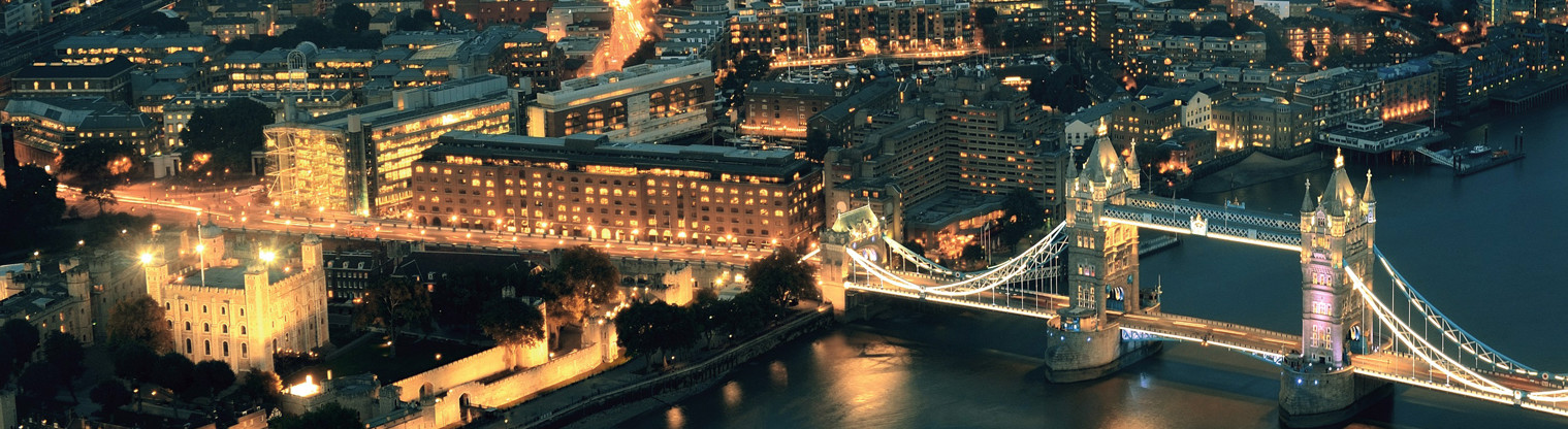 aerial image of a city and a bridge at night